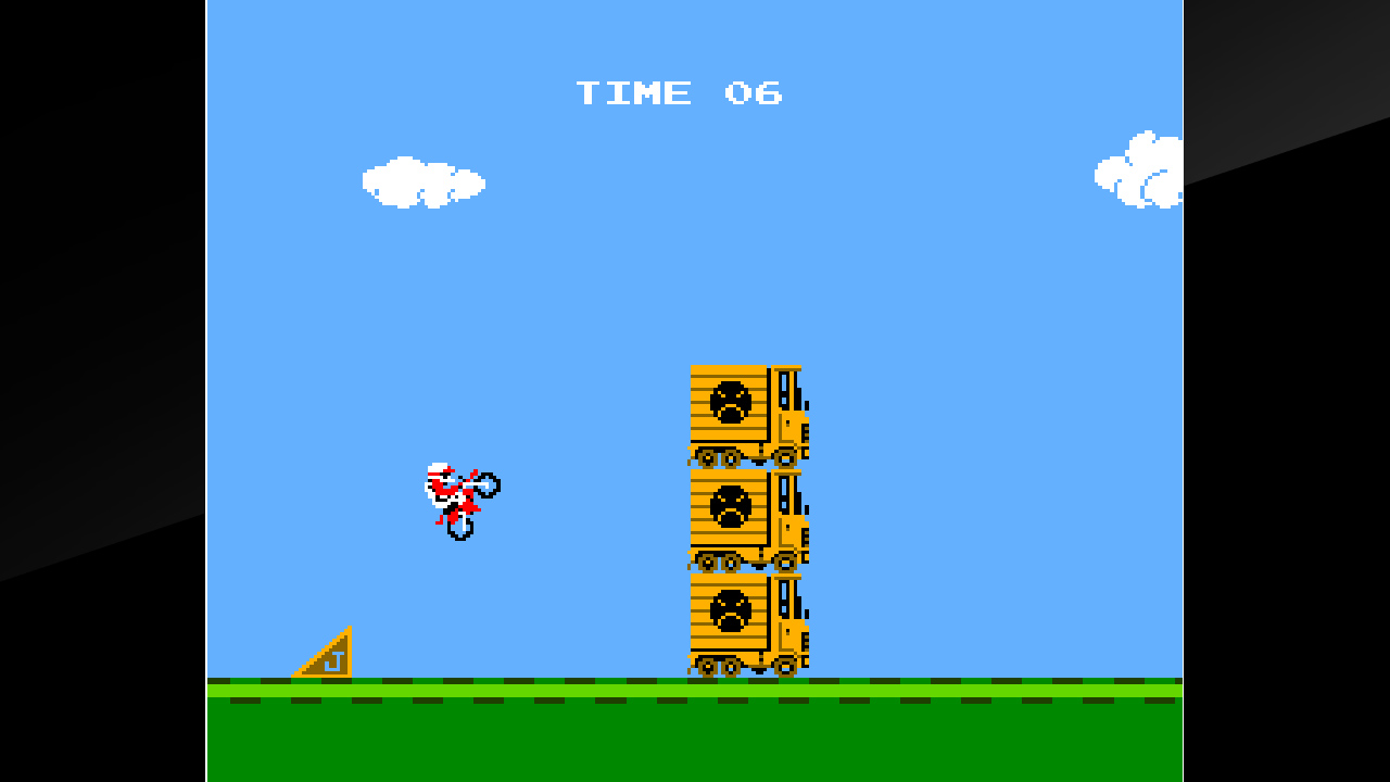 Screen de Arcade Archives Excitebike, portage du jeu VS. Excitebike, une version du jeu avec des stages bonus où l'on fait décoller notre moto au-dessus de piles de camions.